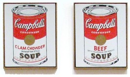 Two framed artworks depict Campbell’s condensed soup cans in Andy Warhol’s pop art style. The left can is labeled “Clam Chowder (Manhattan Style),” and the right can is labeled “Beef (with Vegetables and Barley).” Both cans are white with a red upper section and black lettering, each centered against a plain white background.