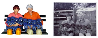 Two side-by-side images show a couple seated with a row of puppies in their arms. On the left, a colorful sculpture depicts them with stylized, bright clothing and vivid blue puppies. On the right, a black-and-white photograph shows the same couple in real life, smiling while holding a similar group of puppies on their laps against a wooden fence backdrop.